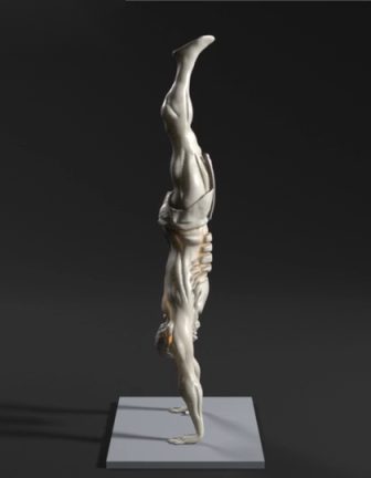 Calix holding a handstand, seen from his left side